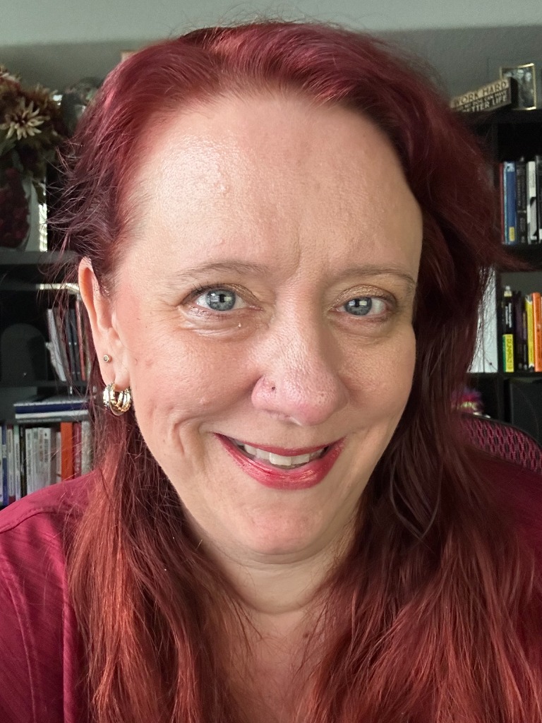 Melissa Ruth smiling in her home study